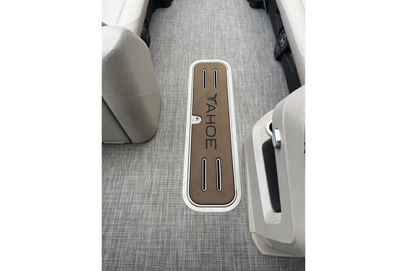 Slide: The Image of 2026 Tahoe 25 LTZ Entertainer boat interior with sleek flooring and seating. - 8