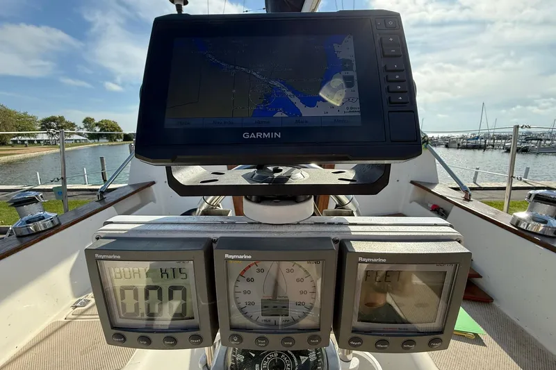 Slide: The Image of Cockpit of 1988 Island Packet 27 sailboat with Garmin navigation and Raymarine instruments. - 18