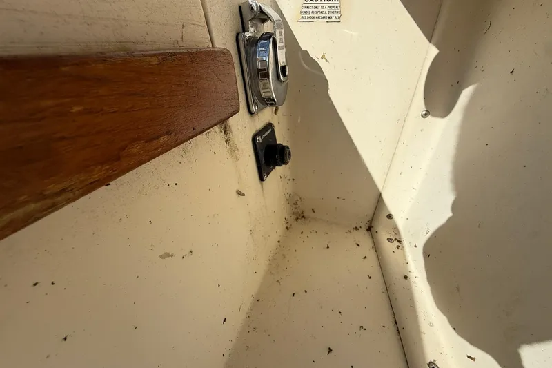 Slide: The Image of 1988 Island Packet 27 interior detail with wood trim and metal fixtures. - 40