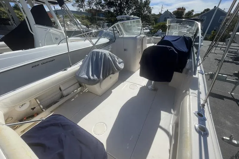 Slide: The Image of 2012 Grady-White Freedom 255 boat interior with covered seating and open deck. - 14