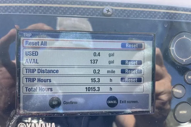 Slide: The Image of Display screen of a 2012 Grady-White Freedom 255 showing trip and fuel data. - 17