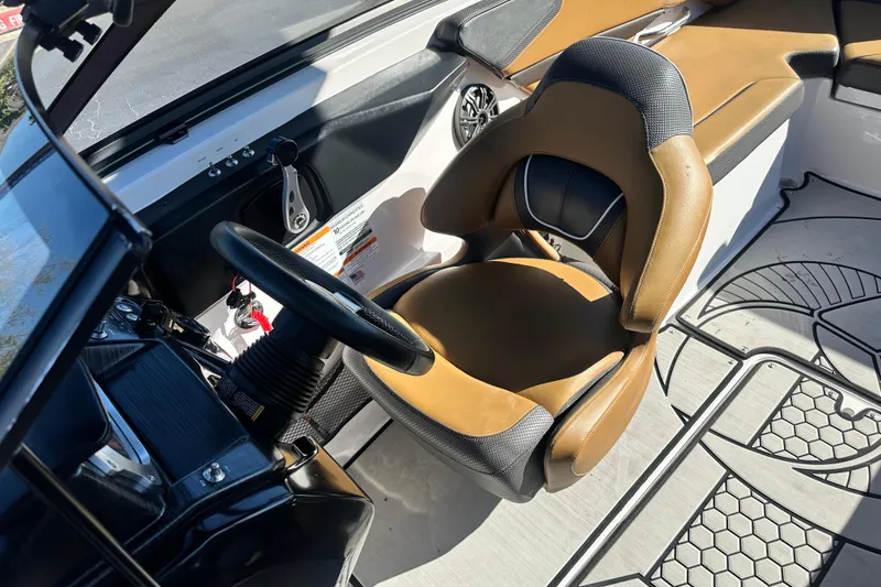 Slide: The Image of 2019 Scarab 215 Wake ID boat interior with tan and black seating. - 16