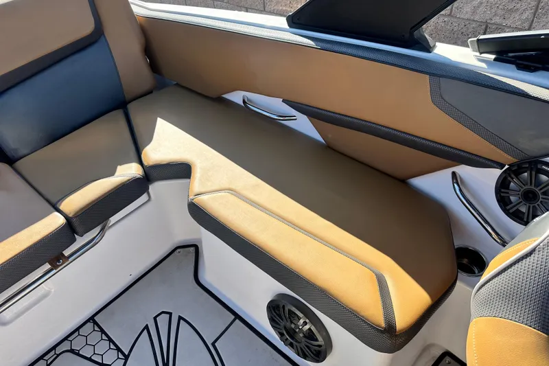 Slide: The Image of 2019 Scarab 215 Wake ID boat interior with steering wheel and seating. - 19