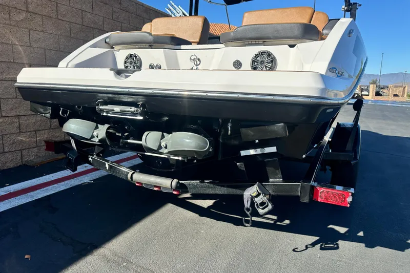 Slide: The Image of 2019 Scarab 215 Wake ID boat on trailer, scenic mountain backdrop. - 3