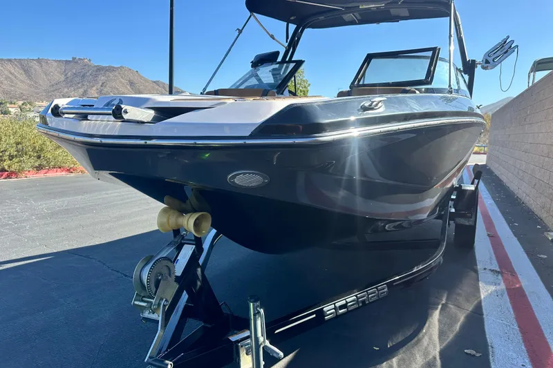 Slide: The Image of 2019 Scarab 215 Wake ID boat interior with tan and gray seating. - 8