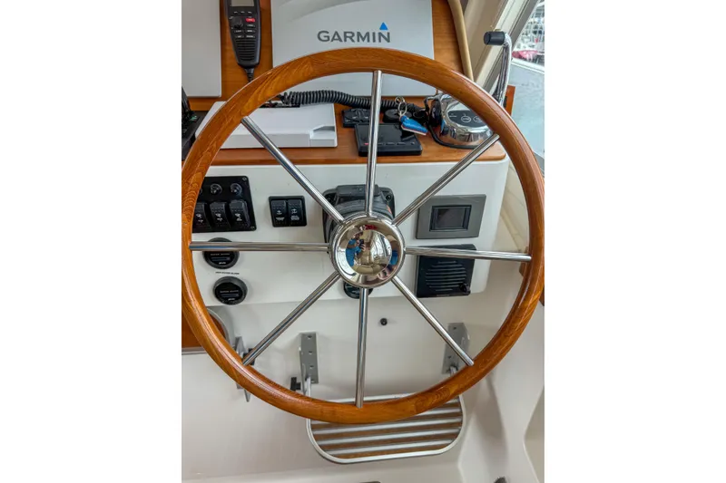 Slide: The Image of Steering wheel of 2016 Back Cove 41 boat with Garmin navigation system. - 17