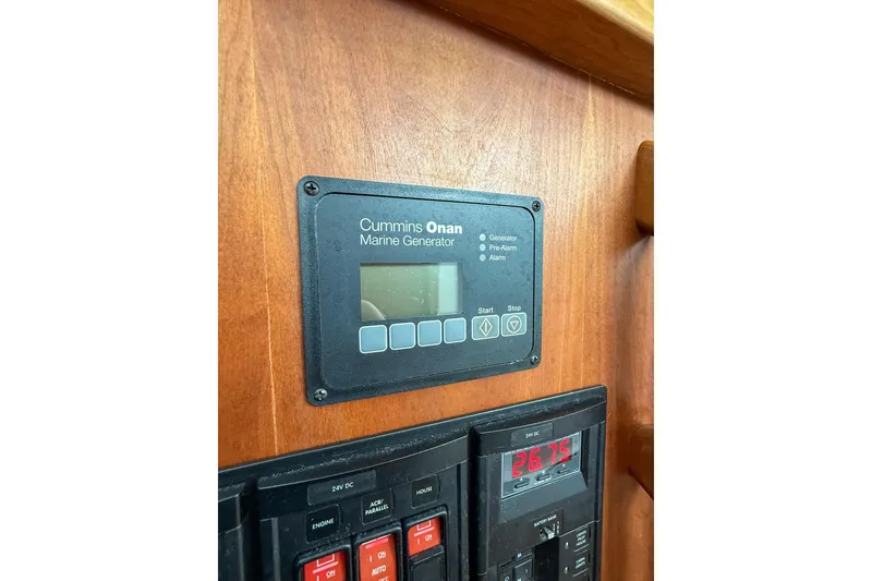 Slide: The Image of Control panel of a 2016 Back Cove 41 boat with Cummins Onan marine generator. - 24
