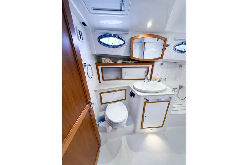 Slide: The Image of Luxurious bathroom interior of 2016 Back Cove 41 yacht, featuring modern fixtures and wood accents. - 32
