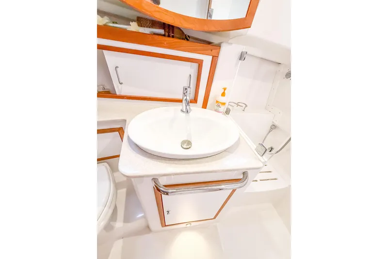 Slide: The Image of 2016 Back Cove 41 yacht bathroom with modern sink and wooden accents. - 34