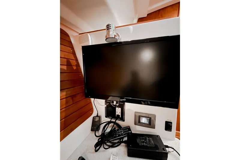 Slide: The Image of Entertainment system in 2016 Back Cove 41 yacht interior with TV and control panel. - 37