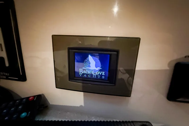 Slide: The Image of Control panel displaying Back Cove Yachts logo on a 2016 Back Cove 41 model. - 38