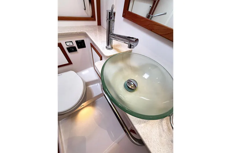 Slide: The Image of Luxurious bathroom in 2016 Back Cove 41 yacht with glass sink and modern fixtures. - 40