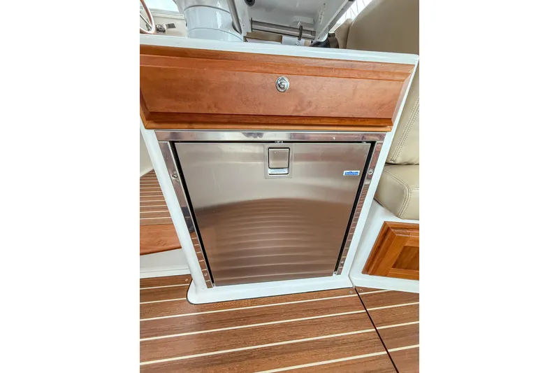 Slide: The Image of Stainless steel fridge on 2016 Back Cove 41 yacht with wooden cabinetry. - 42