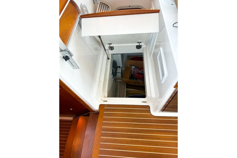 Slide: The Image of 2016 Back Cove 41 yacht interior storage compartment with wooden flooring. - 43
