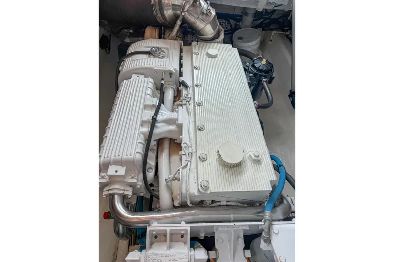 Slide: The Image of Engine compartment of a 2016 Back Cove 41 boat, showcasing detailed machinery. - 45