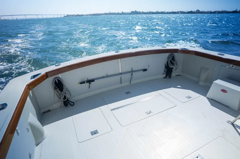 Slide: The Image of 1984 Bertram 35 Convertible boat deck with ocean view and clear skies. - 10