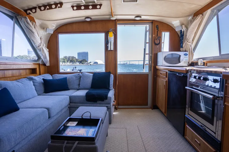 Slide: The Image of Interior of 1984 Bertram 35 Convertible yacht with cozy seating and kitchen area. - 21