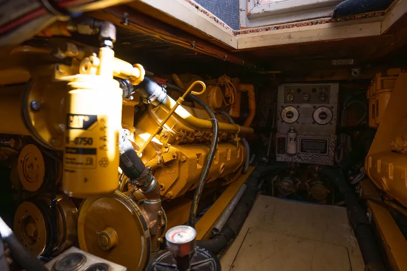 Slide: The Image of Engine room of a 1984 Bertram 35 Convertible boat with visible machinery. - 34