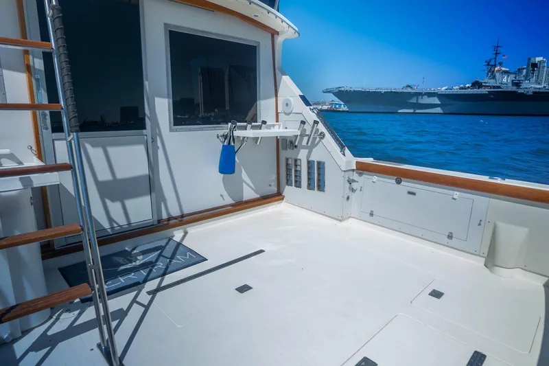 Slide: The Image of 1984 Bertram 35 Convertible yacht deck with ocean view and distant ship. - 8