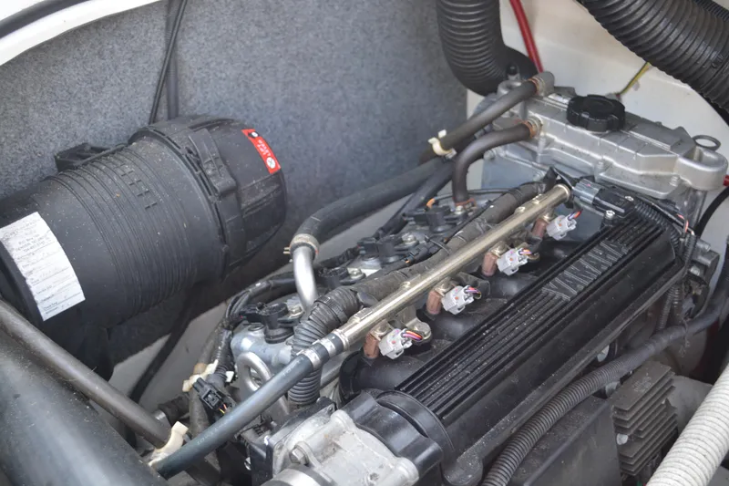 Slide: The Image of 2011 Yamaha AR210 engine compartment showcasing detailed components and wiring. - 20