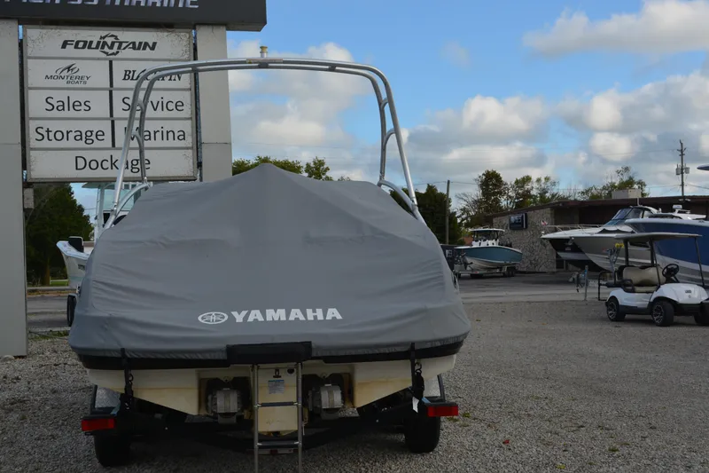 Slide: The Image of 2011 Yamaha AR210 boat covered, parked at a marina with service and storage facilities. - 5