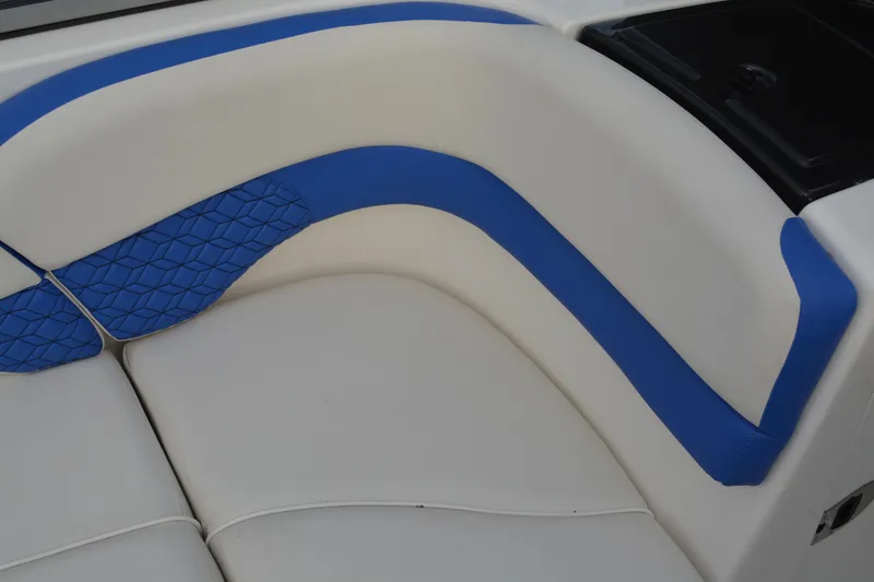 Slide: The Image of 2011 Yamaha AR210 boat interior with blue and white seating. - 8