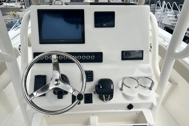 Slide: The Image of Steering console of 2026 Key West 239 FS boat with modern controls and displays. - 11