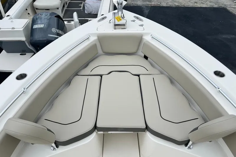 Slide: The Image of 2026 Key West 239 FS boat interior with cushioned seating and Yamaha engine. - 16