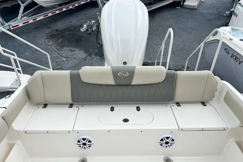 Slide: The Image of 2026 Key West 239 FS boat interior with cushioned seating and storage compartments. - 21