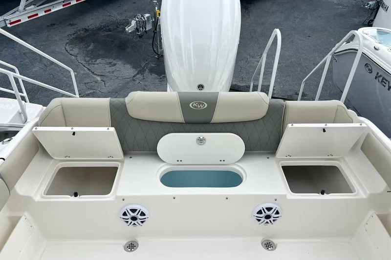 Slide: The Image of 2026 Key West 239 FS boat interior with storage compartments and seating. - 22