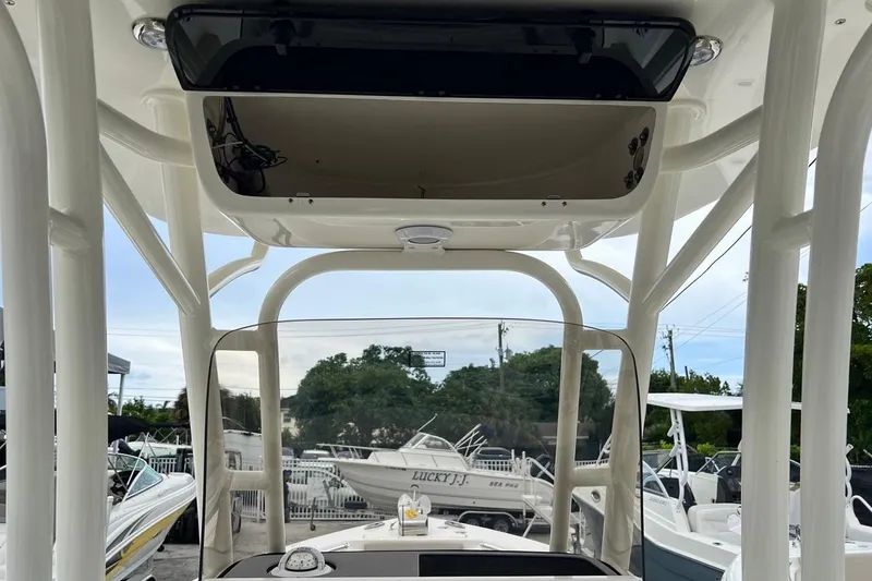 Slide: The Image of 2026 Key West 239 FS boat interior with T-top and console view. - 26