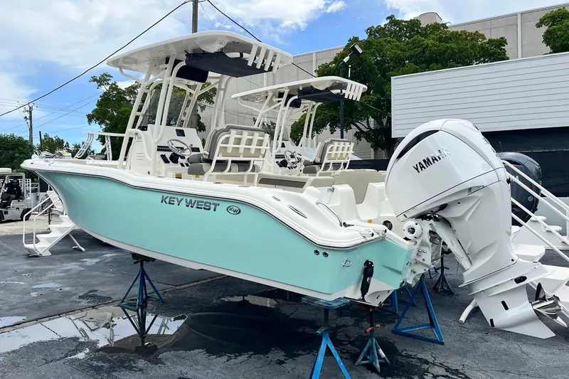 Slide: The Image of 2026 Key West 239 FS boat with Yamaha engine on display outdoors. - 3