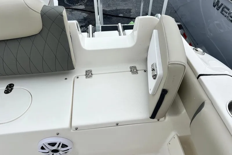 Slide: The Image of 2026 Key West 239 FS boat interior with cushioned seating and storage compartments. - 30