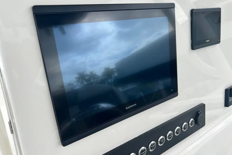 Slide: The Image of Garmin display on 2026 Key West 239 FS boat dashboard with control panel. - 32