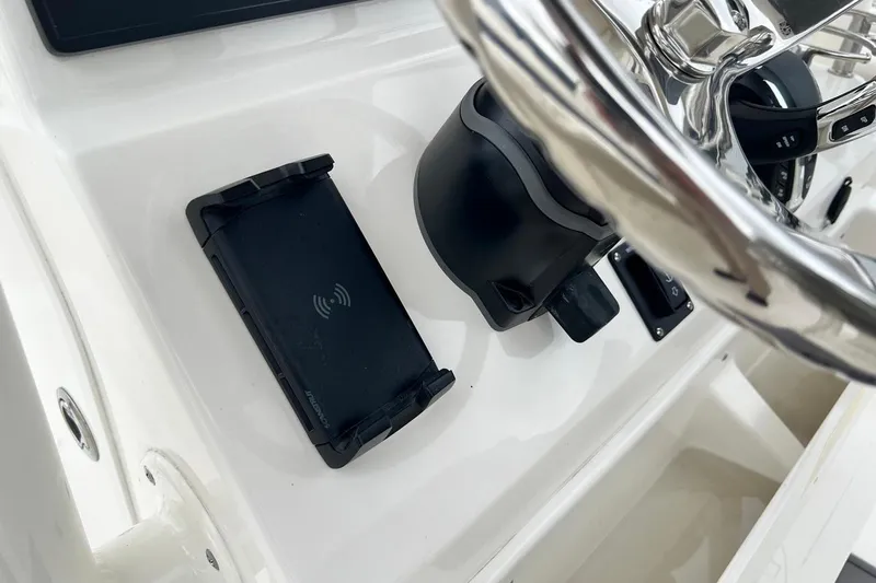 Slide: The Image of Steering console of 2026 Key West 239 FS boat with wireless charging pad. - 34