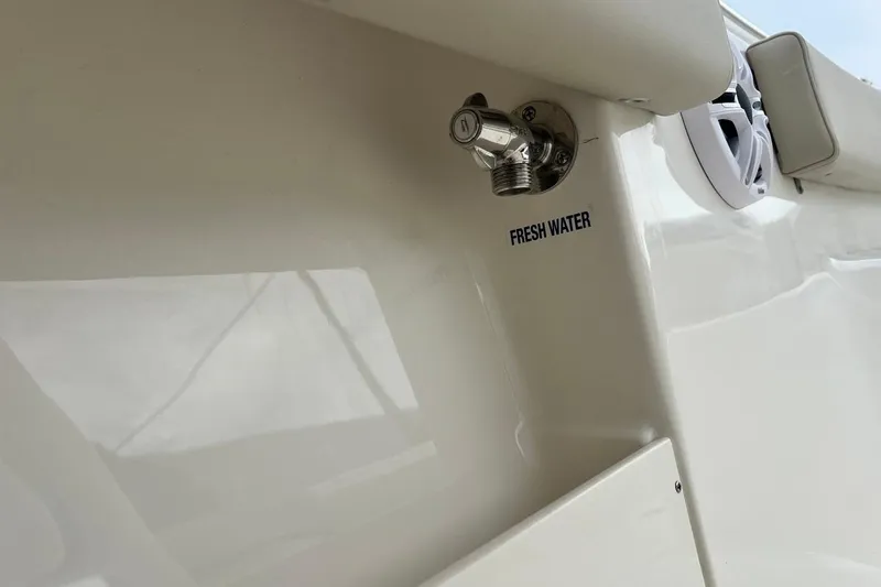Slide: The Image of Fresh water outlet on 2026 Key West 239 FS boat, featuring sleek white design. - 42