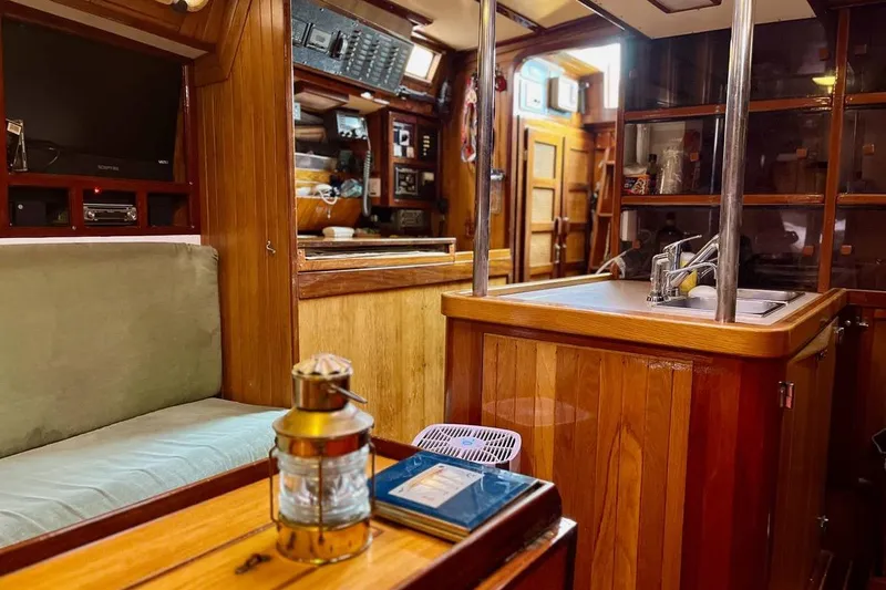 Slide: The Image of Cozy interior of 1989 Fortuna 37 yacht with wooden finishes and modern amenities. - 14