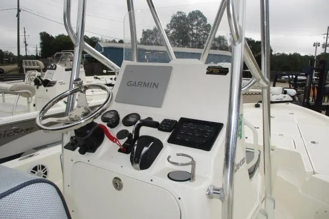 Slide: The Image of 2023 Skeeter SX240 boat console with Garmin navigation system and steering wheel. - 10