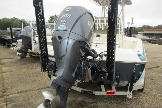 Slide: The Image of 2023 Skeeter SX240 boat with Yamaha 300 V6 engine, rear view. - 8