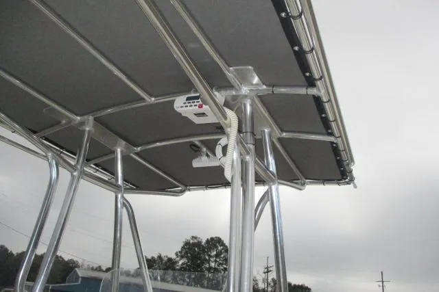 Slide: The Image of 2023 Skeeter SX240 boat canopy with metal frame and electronic equipment. - 9