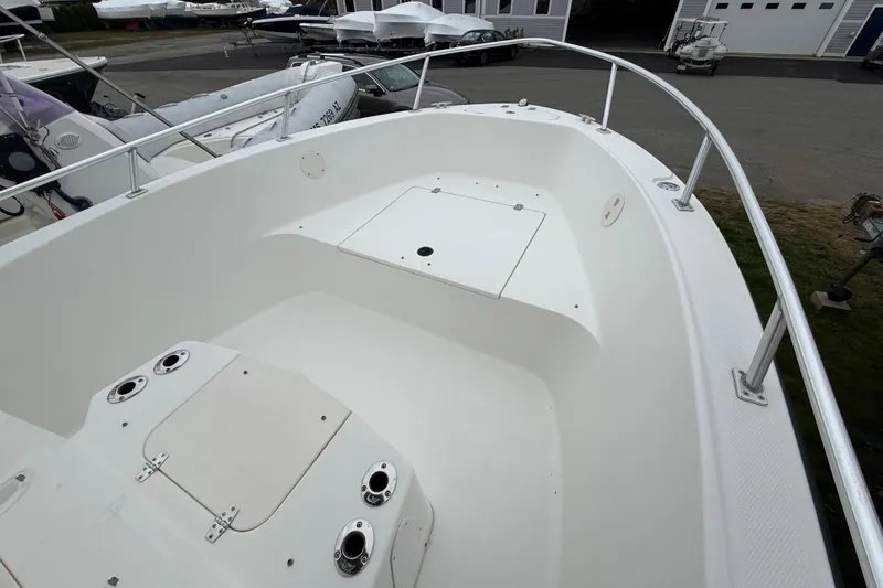 Slide: The Image of 2007 Mako 192 Center Console boat interior with storage compartments and railing. - 11