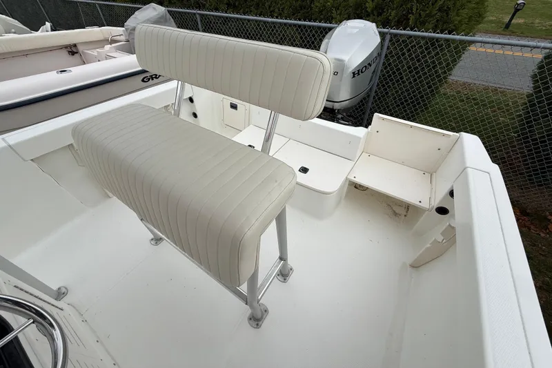 Slide: The Image of 2007 Mako 192 Center Console boat interior with seating and Honda outboard motor. - 15