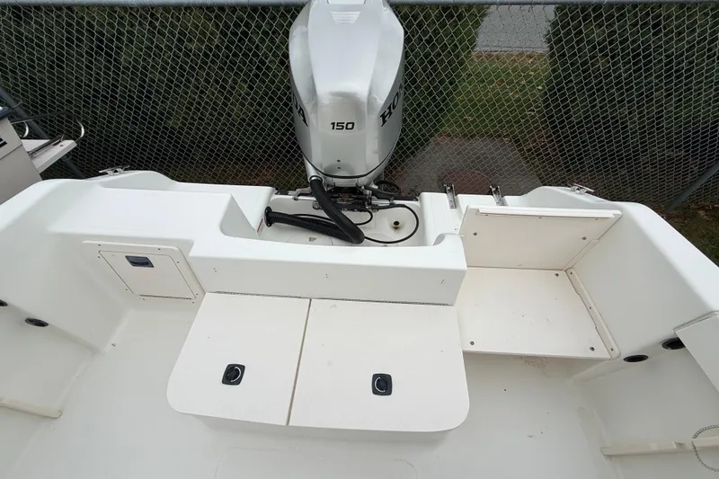 Slide: The Image of 2007 Mako 192 Center Console boat with Honda 150 outboard motor, rear deck view. - 16