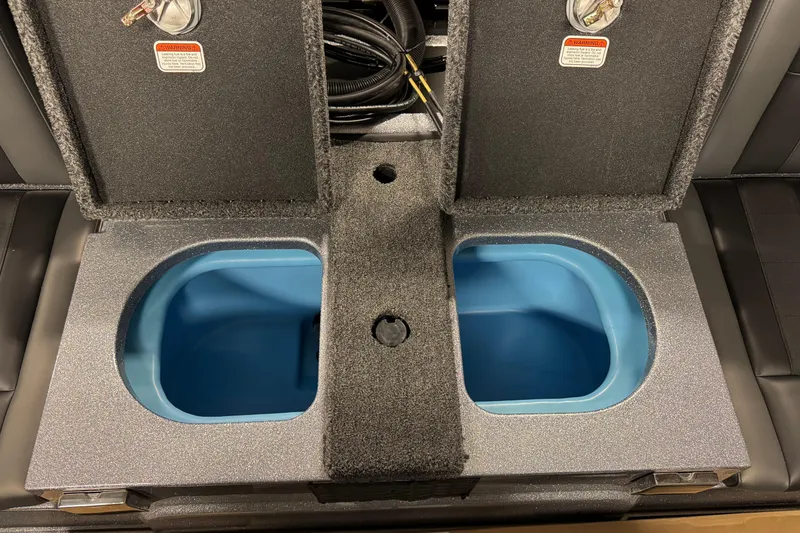 Slide: The Image of 2026 Nitro ZV20 Sport Pro boat storage compartments with blue interior and secure lids. - 10