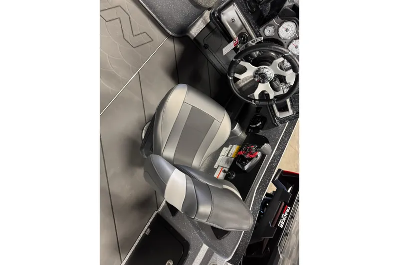 Slide: The Image of 2026 Nitro ZV20 Sport Pro boat interior with steering wheel and gray seating. - 13