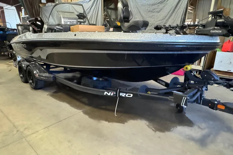 Slide: The Image of 2026 Nitro ZV20 Sport Pro boat on trailer in a garage setting. - 2