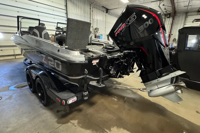 Slide: The Image of 2026 Nitro ZV20 Sport Pro boat with Mercury Pro XS 300 engine in a garage. - 5