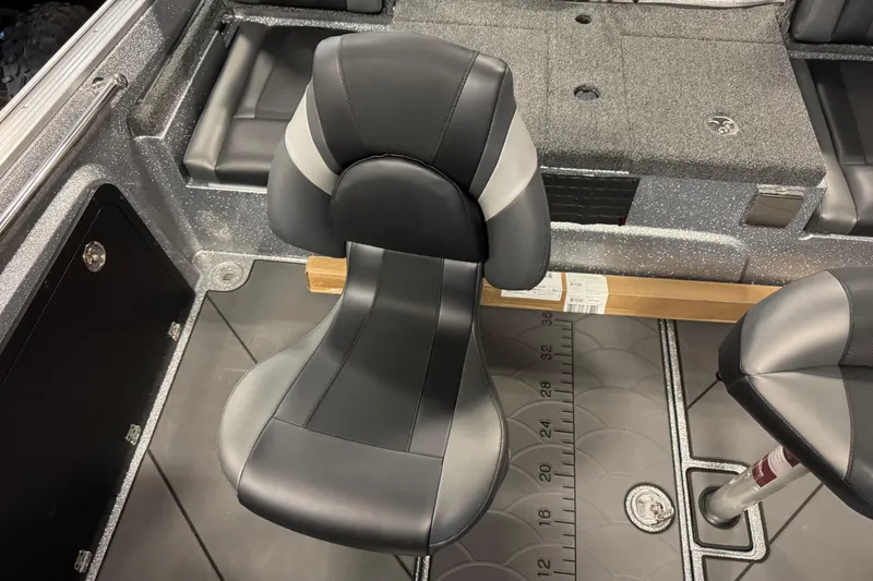 Slide: The Image of 2026 Nitro ZV20 Sport Pro boat interior with sleek black and gray seating. - 6