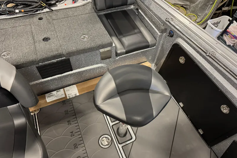 Slide: The Image of Interior of 2026 Nitro ZV20 Sport Pro boat with seating and storage compartments. - 7