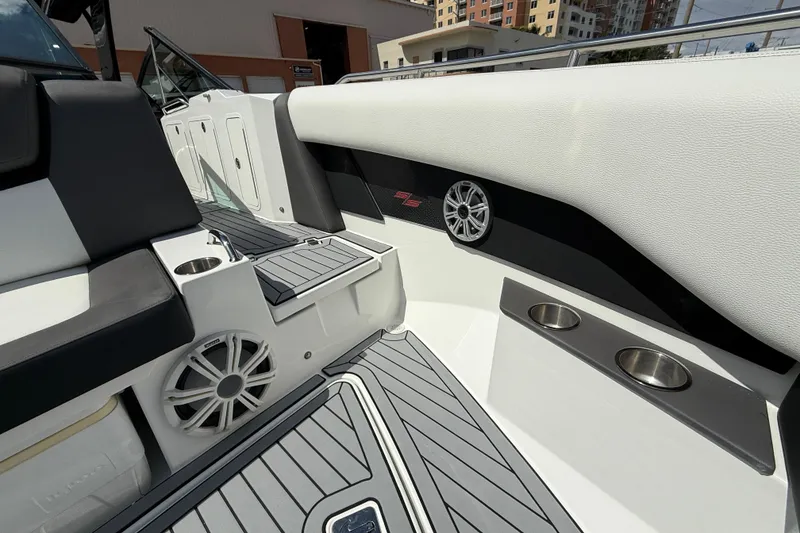 Slide: The Image of 2019 Cruisers Yachts 338 Outboard interior with speakers and cup holders. - 14